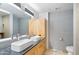 Bathroom features double sinks, unique fixtures and tiled walls at 7131 E Rancho Vista Dr # 1008, Scottsdale, AZ 85251