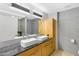 Bathroom featuring dual sinks with modern fixtures and storage cabinets at 7131 E Rancho Vista Dr # 1008, Scottsdale, AZ 85251