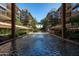 Water feature and lounge in the courtyard with a view of the surrounding condominium residences at 7131 E Rancho Vista Dr # 1008, Scottsdale, AZ 85251