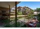 Expansive courtyard view with water features, palm trees, lounge seating, and multi-level residences at 7131 E Rancho Vista Dr # 1008, Scottsdale, AZ 85251