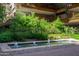 Scenic courtyard featuring a beautiful fountain with lush greenery and multi-story buildings at 7131 E Rancho Vista Dr # 1008, Scottsdale, AZ 85251