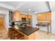 Open kitchen boasts stainless steel appliances, a modern backsplash, and a functional breakfast bar at 7131 E Rancho Vista Dr # 1008, Scottsdale, AZ 85251