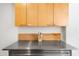 A well-lit kitchen features stainless steel countertops and wooden cabinets, blending style and functionality at 7131 E Rancho Vista Dr # 1008, Scottsdale, AZ 85251