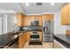 Spacious kitchen features stainless appliances, breakfast bar, and modern lighting at 7131 E Rancho Vista Dr # 1008, Scottsdale, AZ 85251
