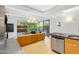 Open living space showcases a tan leather sofa and outdoor views at 7131 E Rancho Vista Dr # 1008, Scottsdale, AZ 85251