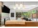 Stylish living room with a large window, modern lighting, and a comfortable sofa perfect for relaxation at 7131 E Rancho Vista Dr # 1008, Scottsdale, AZ 85251