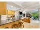 Open-concept with kitchen island, and living area with a fireplace at 7131 E Rancho Vista Dr # 1008, Scottsdale, AZ 85251