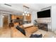 Open-concept living room flowing into a modern kitchen, featuring stylish lighting and a comfortable leather sofa at 7131 E Rancho Vista Dr # 1008, Scottsdale, AZ 85251
