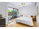 Bright main bedroom with a ceiling fan, large windows, and outdoor views at 7131 E Rancho Vista Dr # 1008, Scottsdale, AZ 85251