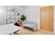 Well-lit office space with modern shelving and comfortable seating area at 7131 E Rancho Vista Dr # 1008, Scottsdale, AZ 85251