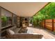 Spacious outdoor patio features seating, privacy, and a beautiful landscape with lush green foliage at 7131 E Rancho Vista Dr # 1008, Scottsdale, AZ 85251