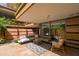 Charming patio with chic seating, decorative rug, and a serene ambiance offering a delightful outdoor living space at 7131 E Rancho Vista Dr # 1008, Scottsdale, AZ 85251