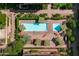 Aerial view of the community pool with seating, umbrellas and lush landscaping at 7131 E Rancho Vista Dr # 1008, Scottsdale, AZ 85251