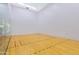 Indoor racquetball court with pristine hardwood floors and smooth walls, ideal for sports and recreation at 7131 E Rancho Vista Dr # 1008, Scottsdale, AZ 85251