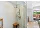 Shower with glass door, rain style shower head and tiled walls at 7131 E Rancho Vista Dr # 1008, Scottsdale, AZ 85251