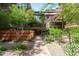 Community brick walkway with lush landscaping and mature trees at 7131 E Rancho Vista Dr # 1008, Scottsdale, AZ 85251