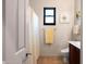 Bright bathroom features a shower, toilet, vanity with ample lighting, and a window for natural light at 7445 E Eagle Crest Dr # 1015, Mesa, AZ 85207