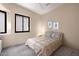 Cozy bedroom featuring neutral walls, plush carpeting, and a comfortable bed with soft bedding at 7445 E Eagle Crest Dr # 1015, Mesa, AZ 85207