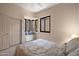 Comfortable bedroom featuring a bay window, window seat, plush carpeting, and a soft bed at 7445 E Eagle Crest Dr # 1015, Mesa, AZ 85207