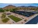 Aerial view of the community bocce ball and tennis courts, with mountain views and a relaxing pavilion at 7445 E Eagle Crest Dr # 1015, Mesa, AZ 85207
