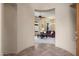 Spacious foyer leading into a well-lit living area with comfortable seating and a view to the outdoor areas at 7445 E Eagle Crest Dr # 1015, Mesa, AZ 85207