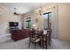 Open-concept living and dining area with plush seating, large windows, and views of the outdoor landscaping at 7445 E Eagle Crest Dr # 1015, Mesa, AZ 85207