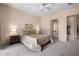 Inviting main bedroom with soft carpet, ceiling fan, neutral paint and an attached en-suite bath at 7445 E Eagle Crest Dr # 1015, Mesa, AZ 85207