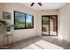 Sun room featuring tile floors, ceiling fan, large windows, and sliding glass door to outdoor patio at 7445 E Eagle Crest Dr # 1015, Mesa, AZ 85207