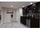 Finished basement bar area features wine storage and sleek countertops at 8337 E Shetland Trl, Scottsdale, AZ 85258