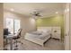 Bright bedroom with gray tile flooring, neutral walls, and a ceiling fan at 8337 E Shetland Trl, Scottsdale, AZ 85258