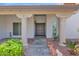 Inviting front entrance with stone walkway leading to a decorative front door and column features at 8337 E Shetland Trl, Scottsdale, AZ 85258