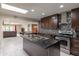 Bright kitchen with an island and stainless-steel appliances and an open view to living space at 8337 E Shetland Trl, Scottsdale, AZ 85258