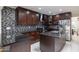 Modern kitchen features sleek countertops, stainless steel appliances, and mosaic tile backsplash at 8337 E Shetland Trl, Scottsdale, AZ 85258