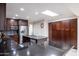 Beautiful kitchen with a stainless steel refrigerator, tile backsplash, and island with dark countertops at 8337 E Shetland Trl, Scottsdale, AZ 85258