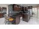 Modern kitchen boasts granite countertops, a wine rack, and stainless steel appliances at 8337 E Shetland Trl, Scottsdale, AZ 85258