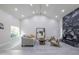 Spacious living room with vaulted ceilings, a cozy seating area, and a modern fireplace at 8337 E Shetland Trl, Scottsdale, AZ 85258