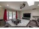 Living room featuring a plush area rug, skylight, and French doors to the backyard at 8337 E Shetland Trl, Scottsdale, AZ 85258