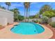 Backyard featuring a refreshing pool, perfect for hot days, surrounded by lush greenery at 8337 E Shetland Trl, Scottsdale, AZ 85258