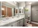 Bright bathroom featuring double sinks, offering convenience and ample space for daily routines at 11596 W Sierra Dawn Blvd # 307, Surprise, AZ 85378