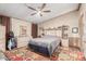Cozy bedroom with built-in shelving and a ceiling fan, creating a peaceful retreat for relaxation at 11596 W Sierra Dawn Blvd # 307, Surprise, AZ 85378