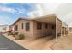 Cozy single-story home with covered parking and tidy desert landscaping at 11596 W Sierra Dawn Blvd # 307, Surprise, AZ 85378