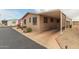 Cozy single-story home with covered parking and tidy desert landscaping at 11596 W Sierra Dawn Blvd # 307, Surprise, AZ 85378