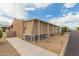 Mobile home featuring a covered front patio and well-maintained desert landscaping at 11596 W Sierra Dawn Blvd # 307, Surprise, AZ 85378
