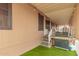 Outdoor patio with a grill for cooking and entertaining, and turf at 11596 W Sierra Dawn Blvd # 307, Surprise, AZ 85378