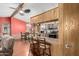 Kitchen with breakfast bar connects to a dining area, creating a spacious, integrated living space at 11596 W Sierra Dawn Blvd # 307, Surprise, AZ 85378