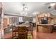 Eat-in kitchen with wood cabinets, updated appliances, and a ceiling fan for added comfort at 11596 W Sierra Dawn Blvd # 307, Surprise, AZ 85378