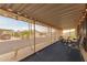 Relaxing screened-in patio perfect for enjoying the outdoors with string lights at 11596 W Sierra Dawn Blvd # 307, Surprise, AZ 85378