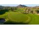 Picturesque golf course with lush green fairways and scenic mountain views at 12940 W Creosote Dr, Peoria, AZ 85383