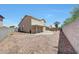 The backyard features a covered patio, a gravel yard, and mature landscaping at 13676 N 73Rd Dr, Peoria, AZ 85381