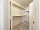 Walk-in closet with built-in shelving units, great for storage and organization at 13676 N 73Rd Dr, Peoria, AZ 85381